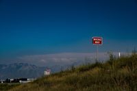 A sign along a road that says "wrong way." Further down the road is another sign that says "wrong way."